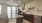 a kitchen with white cabinets