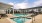 a swimming pool in front of a building