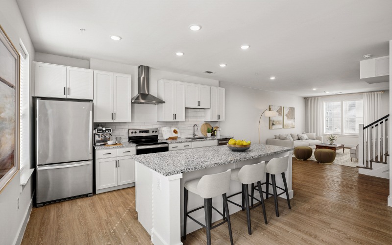 Kitchen with island, stainless steel appliances, quartz countertops