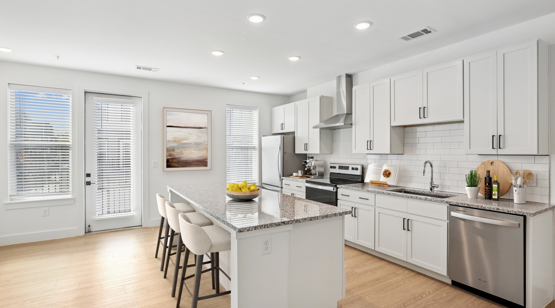 a kitchen with white cabinets