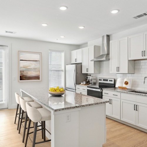 a kitchen with white cabinets