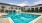 a swimming pool in front of a building