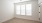 a room with a window and a wood floor
