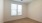 a room with a window and a wood floor
