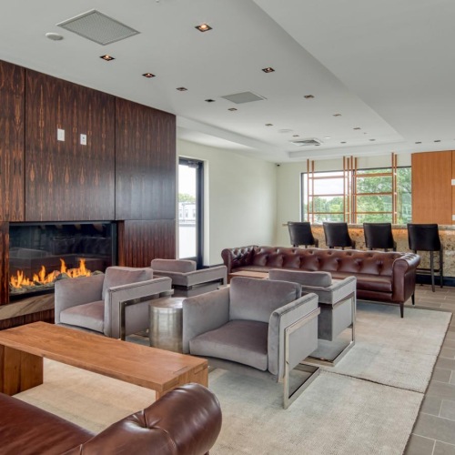 Access to resident-only features a living room with a fireplace
