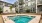 a swimming pool in front of a building