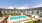 a swimming pool in front of a large building