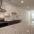 a kitchen with white cabinets