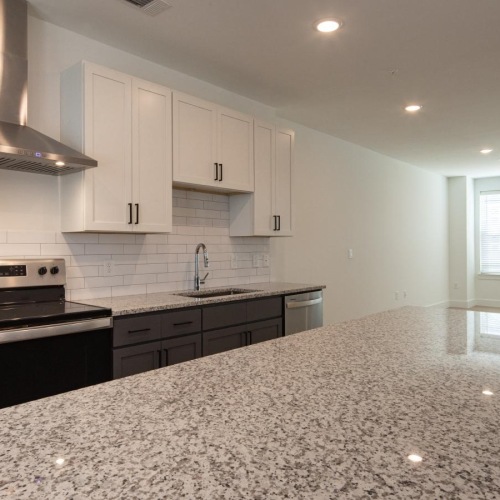 Spacious kitchens with thoughtful details a kitchen with white cabinets