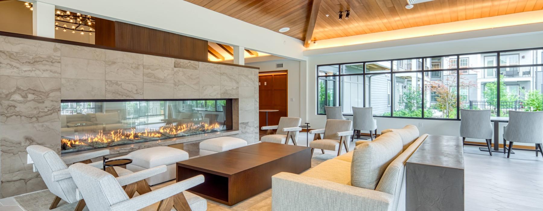 a room with a couch and chairs