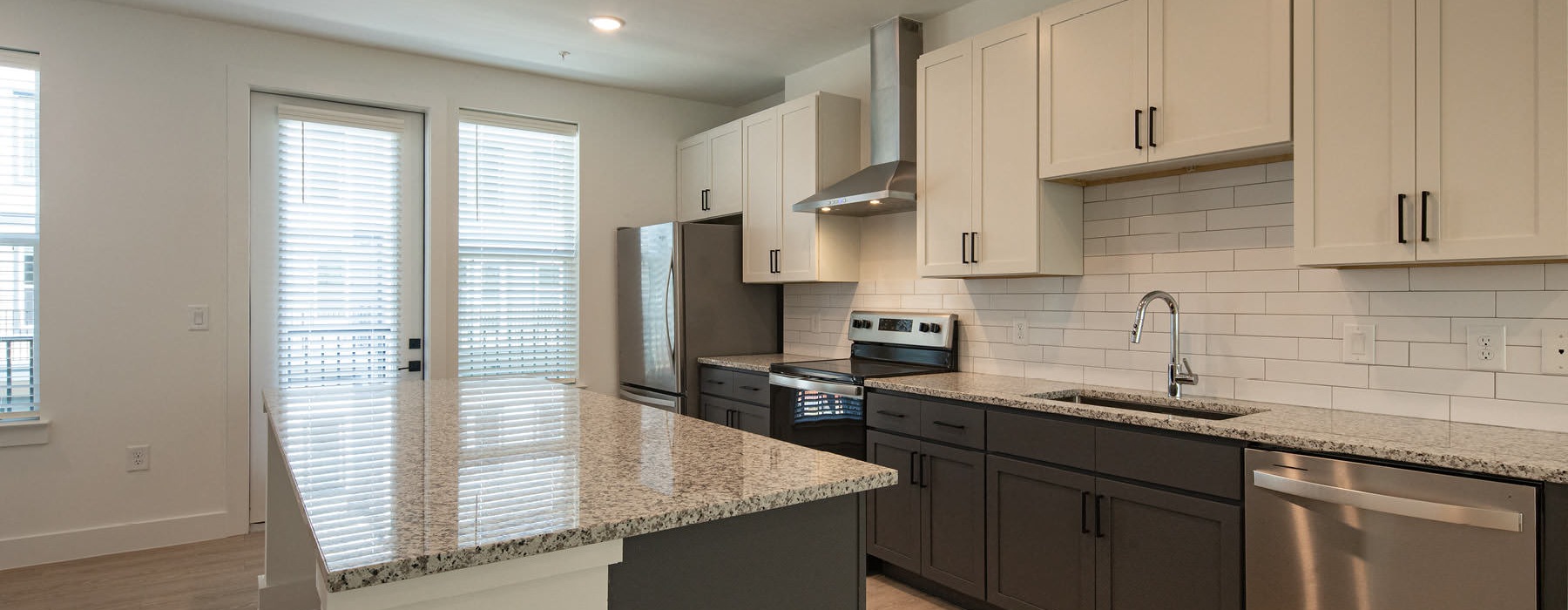 a kitchen with white cabinets