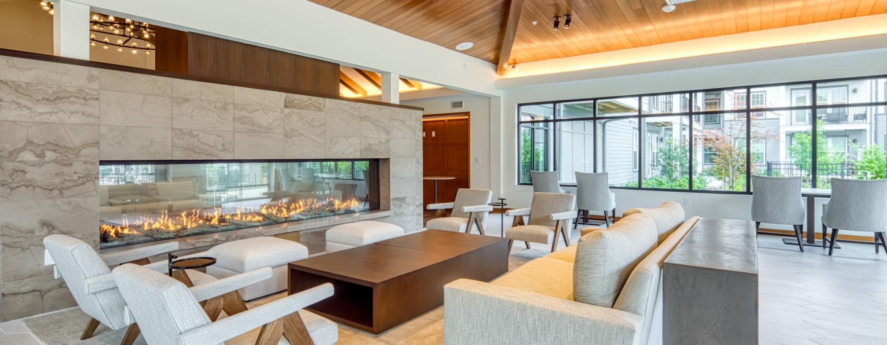 a room with a couch and chairs