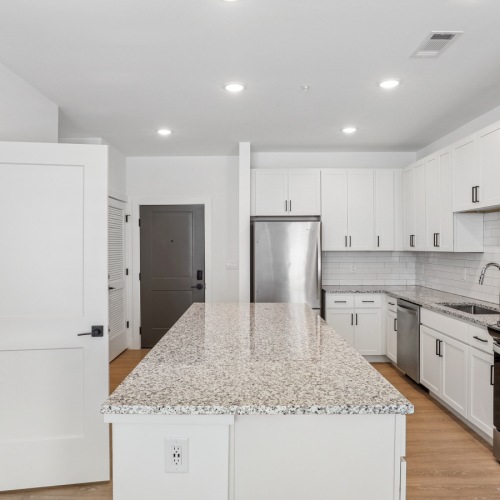 a kitchen with white cabinets